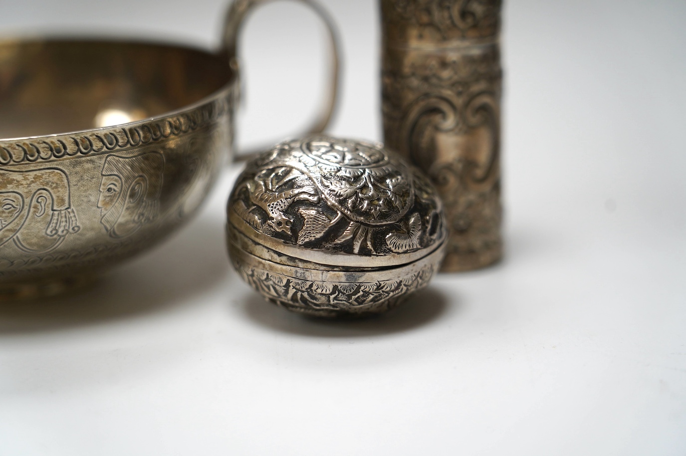 An Edwardian silver replica of a Mycenaean cup, Nathan & Hayes, Chester, 1912, height 62mm, together with a late Victorian silver mounted scent flask, two silver condiments and an Indian white metal box and cover. Condit